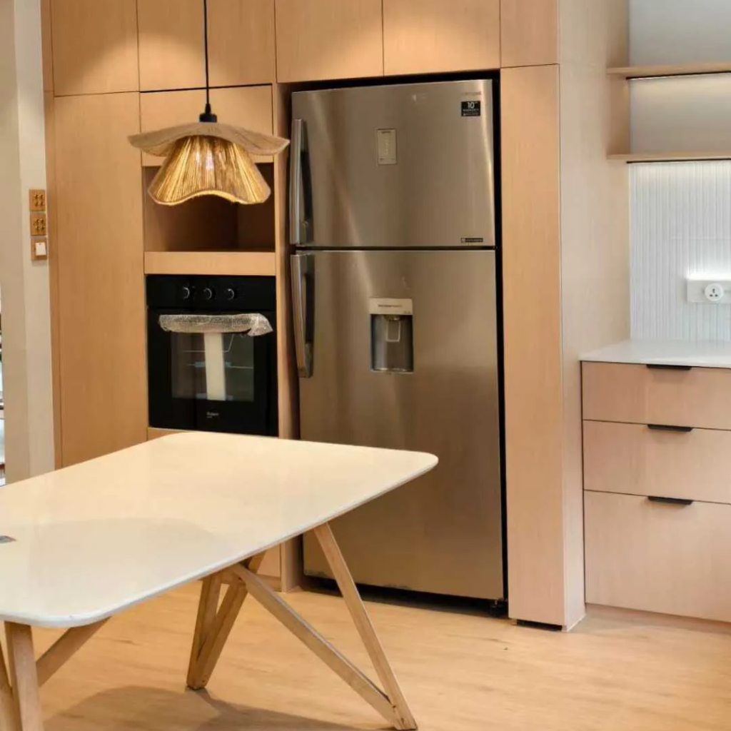 Full view of modern custom wood cabinetry with white island